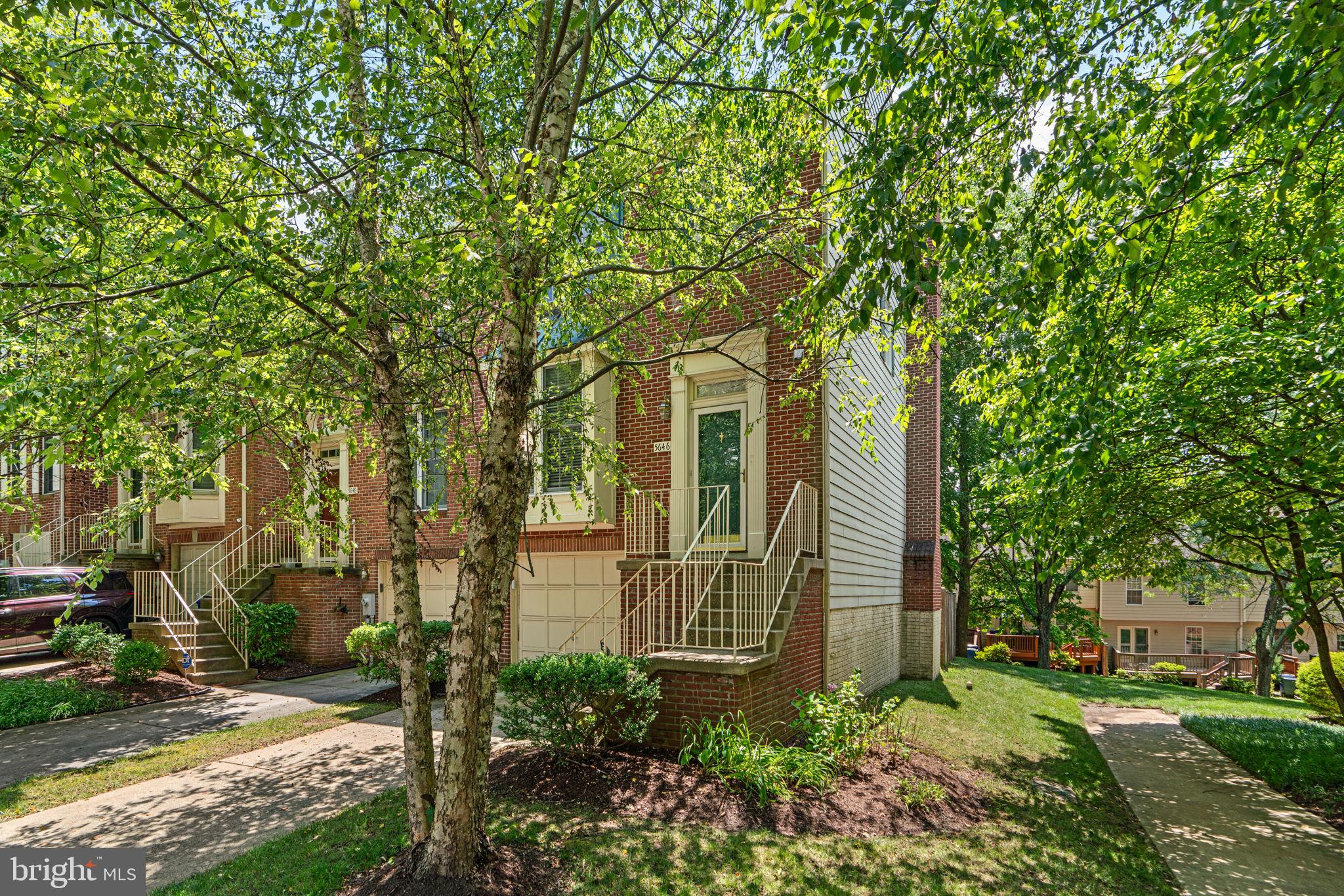 5646 April Journey, Unit 50 Columbia, MD 21044 - Photo 3 of 32 a front view of a house with garden