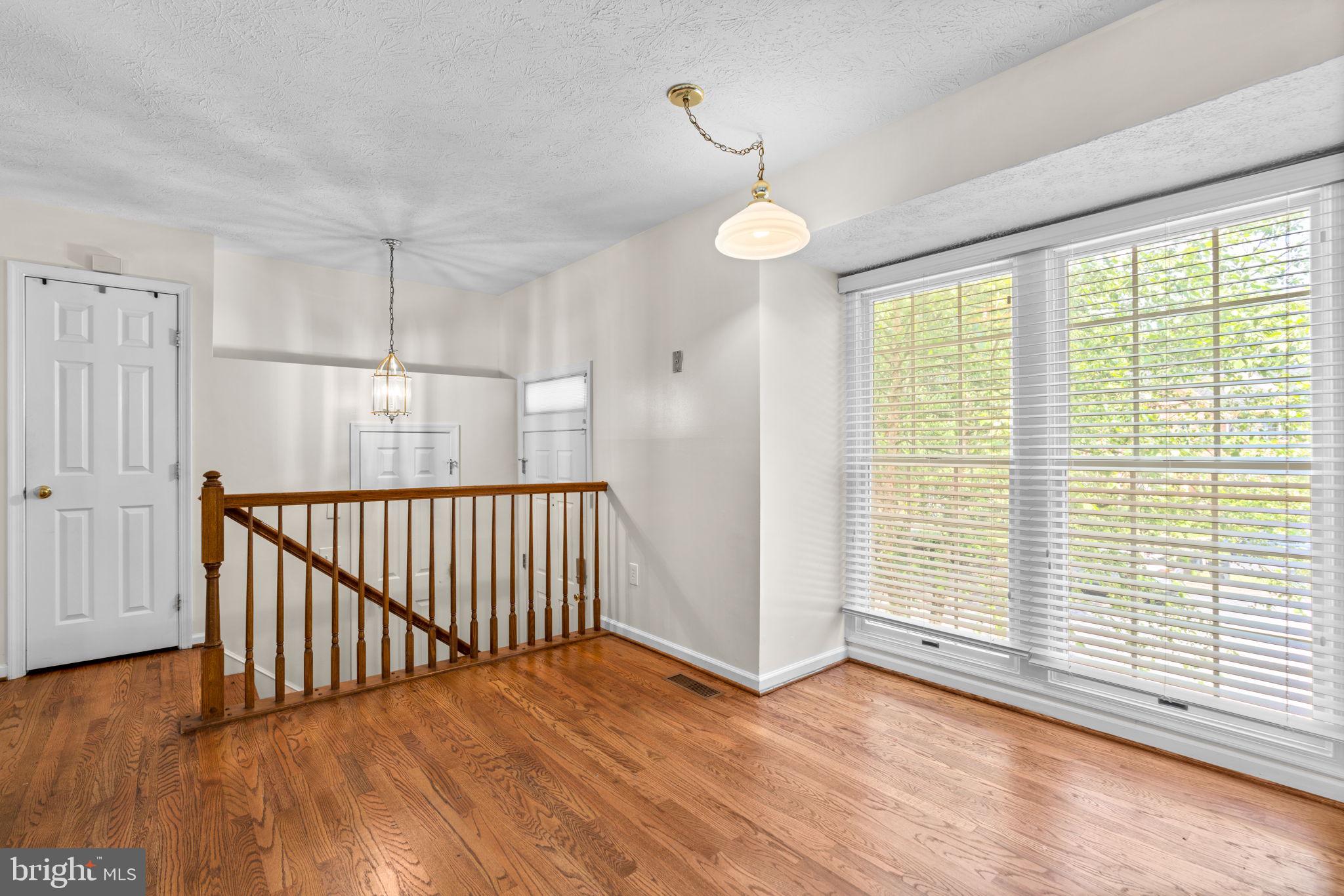 5646 April Journey, Unit 50 Columbia, MD 21044 - Photo 4 of 32 a view of livingroom with hardwood floor and window