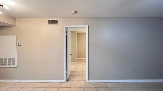 a kitchen that has a sink and a stove top oven