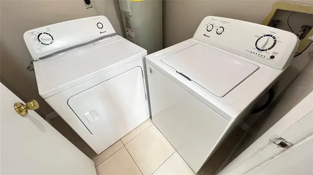 a utility room with dryer and washer
