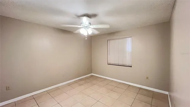 a bathroom with a toilet sink and shower