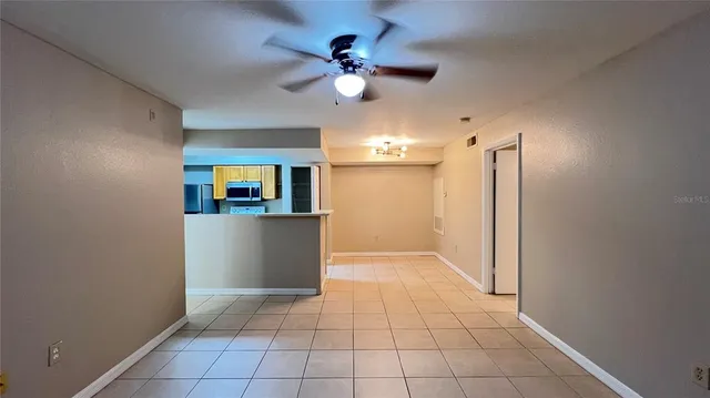 a view of a kitchen with a sink and a window