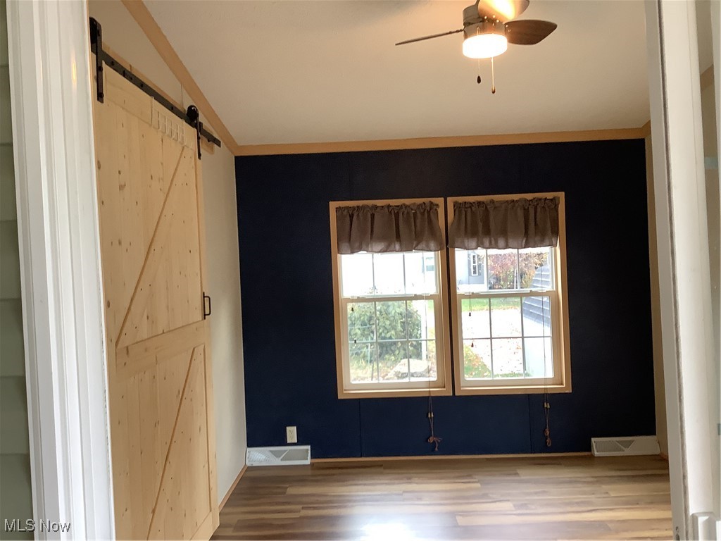 8927 Columbus Road Mount Vernon, OH 43050 - Photo 10 of 35 Great bonus room with several options (den, office, etc.) plus new floating laminate flooring.