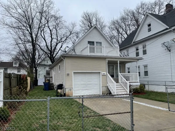 a front view of a house with garage