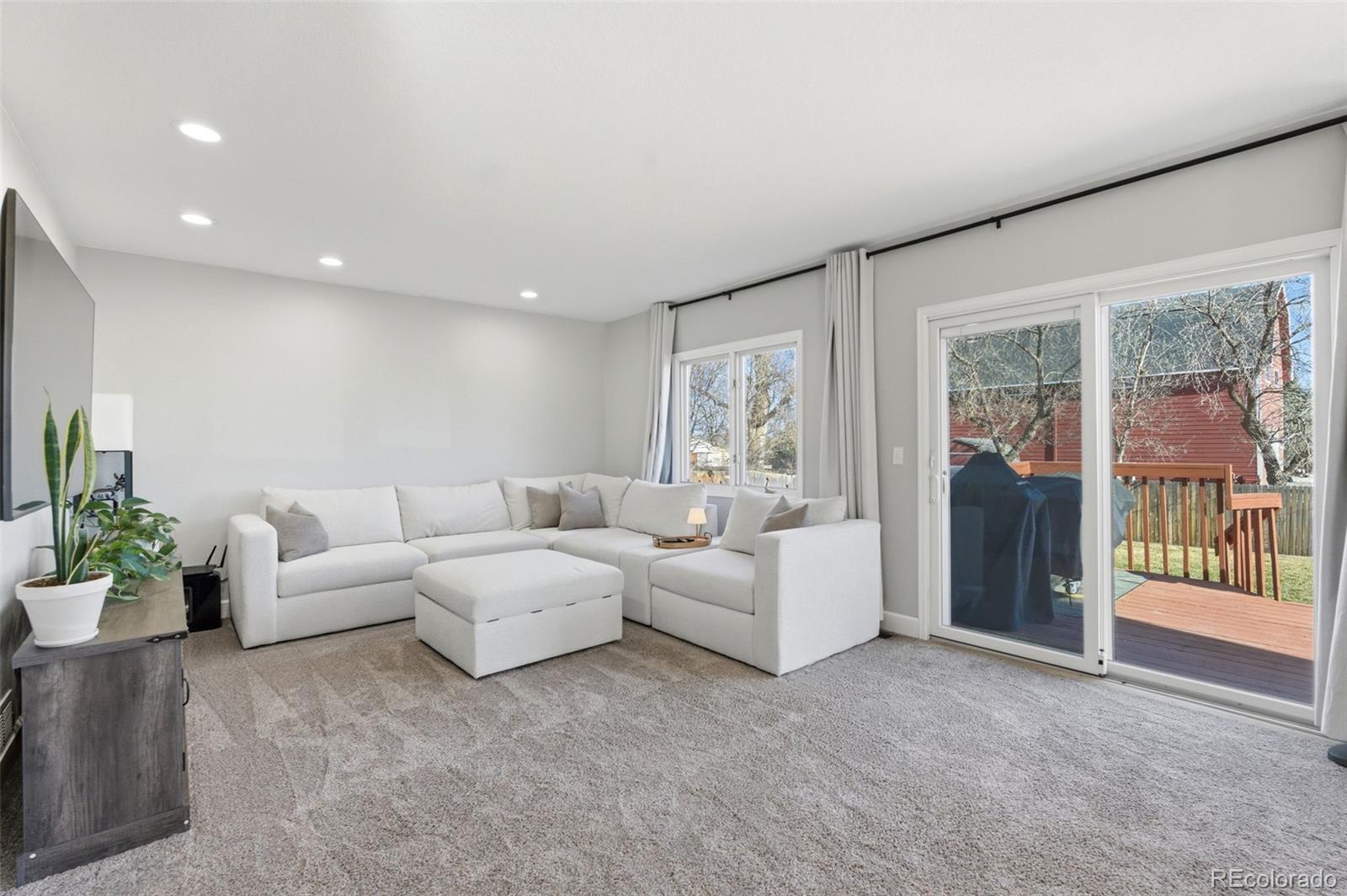 4418 Fig Street Golden, CO 80403 - Photo 12 of 50 a living room with furniture and a large window