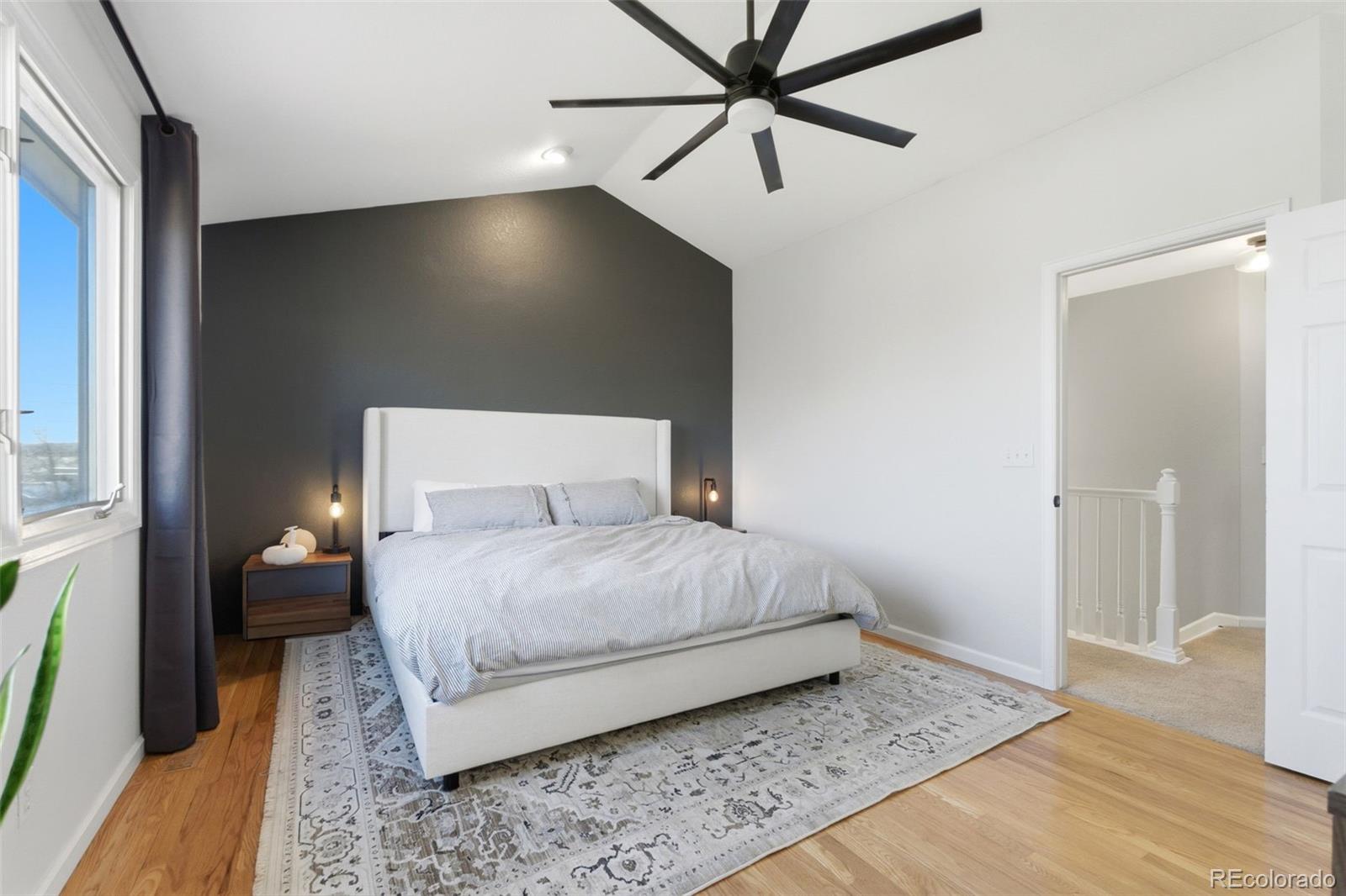 4418 Fig Street Golden, CO 80403 - Photo 18 of 50 a bedroom with a bed and a mirror