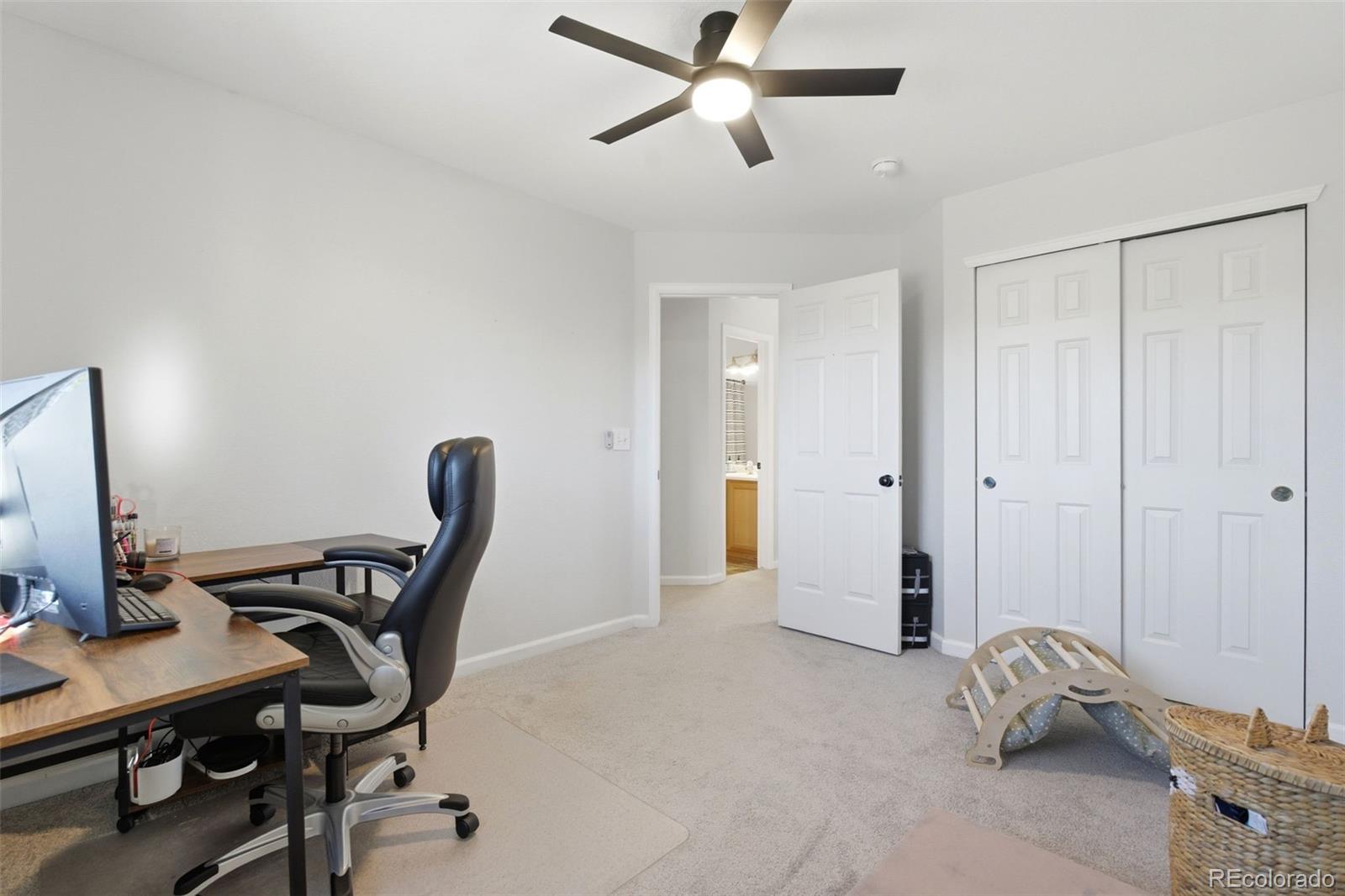 4418 Fig Street Golden, CO 80403 - Photo 28 of 50 a view of a workspace with furniture and a window