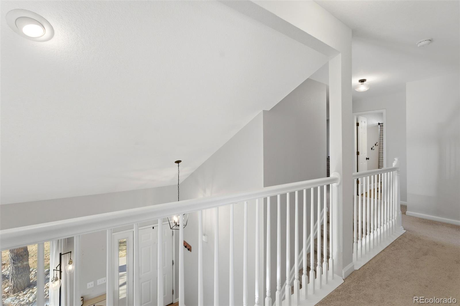 4418 Fig Street Golden, CO 80403 - Photo 29 of 50 a view of a hallway with stairs