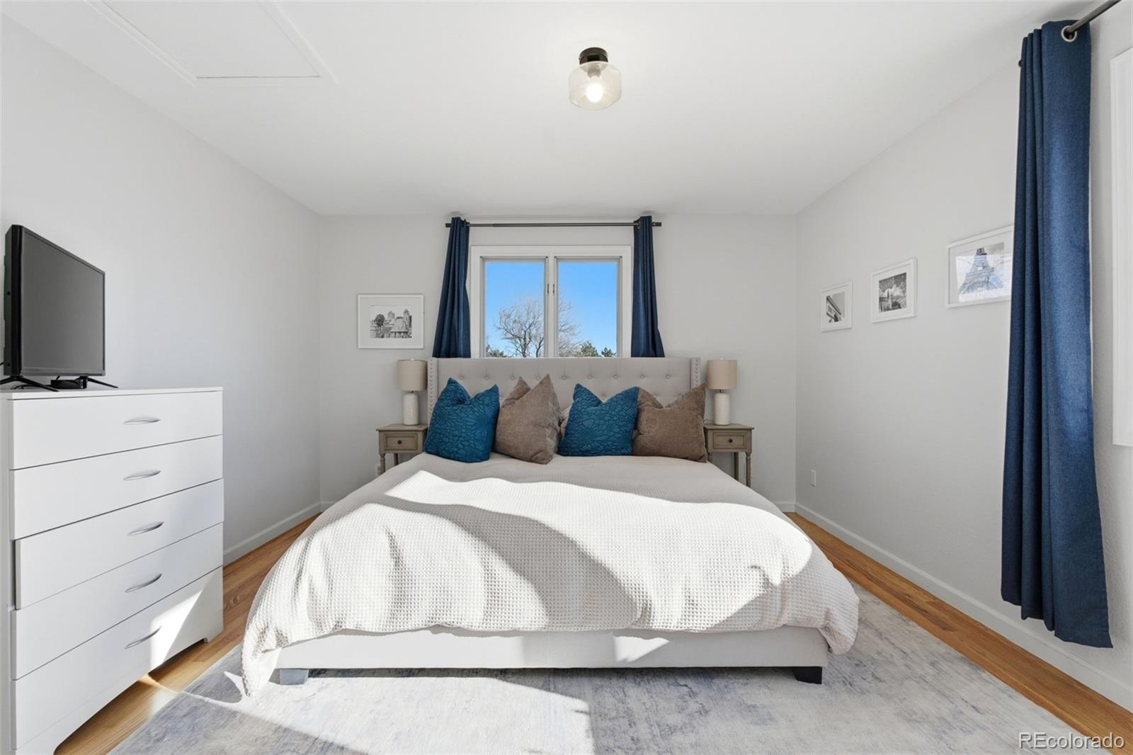 4418 Fig Street Golden, CO 80403 - Photo 30 of 50 a large white bed in a white room