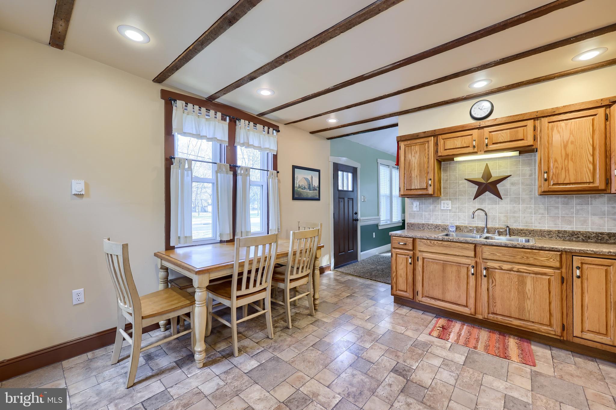 420 North Water Street Lititz, PA 17543 - Photo 33 of 43 a kitchen with granite countertop a sink and chairs
