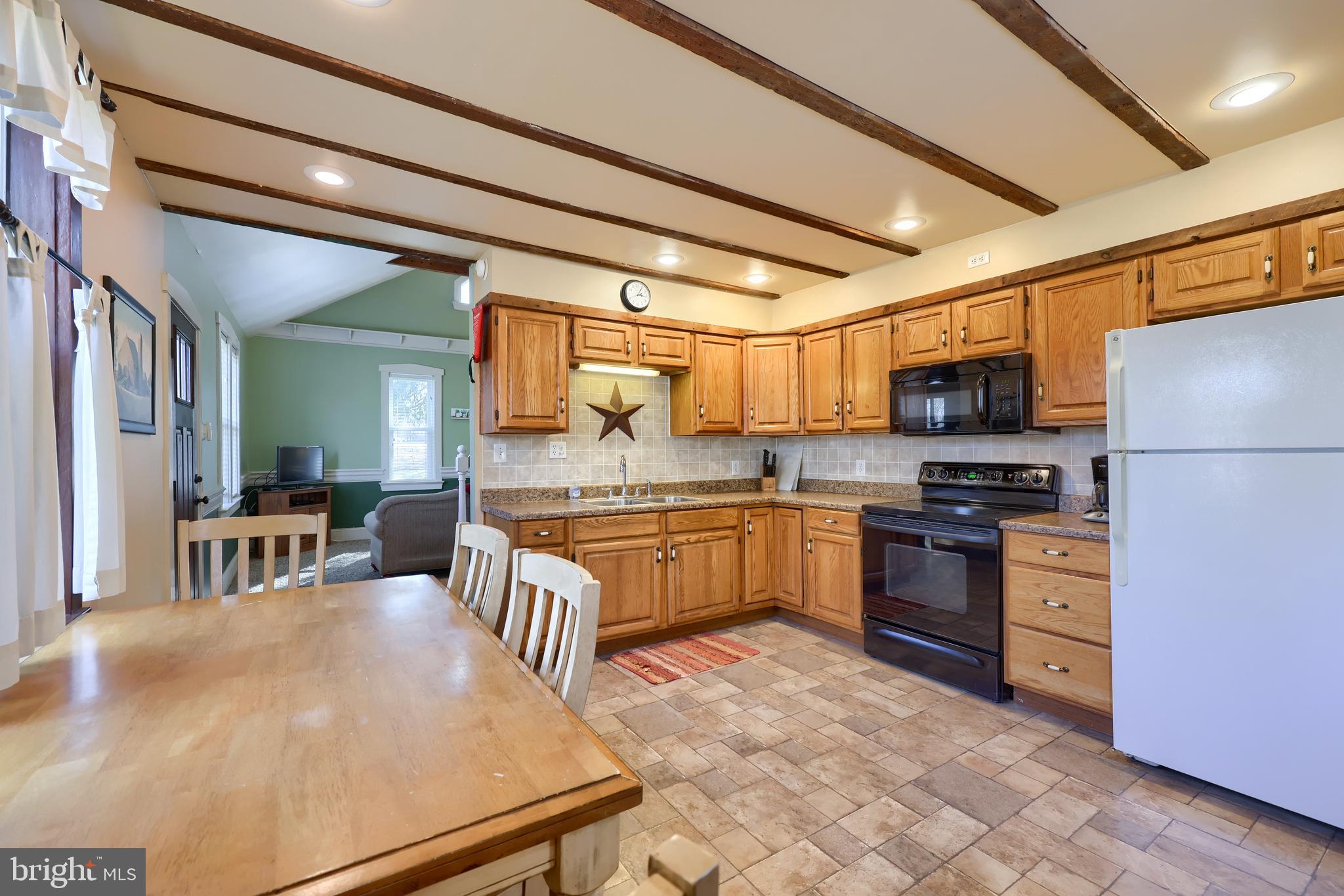 420 North Water Street Lititz, PA 17543 - Photo 34 of 43 a kitchen with granite countertop a stove cabinets and refrigerator