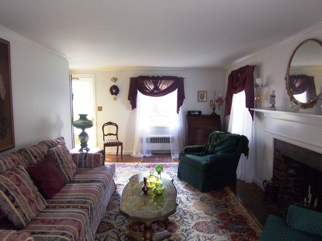 39 Coolidge Road Milton, MA 02186 - Photo 3 of 13 a living room with furniture fireplace and window