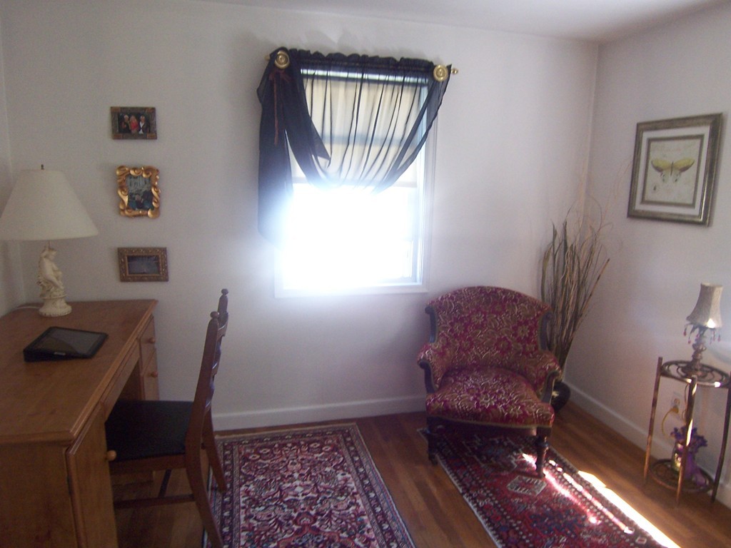 39 Coolidge Road Milton, MA 02186 - Photo 8 of 13 a living room with furniture and a window