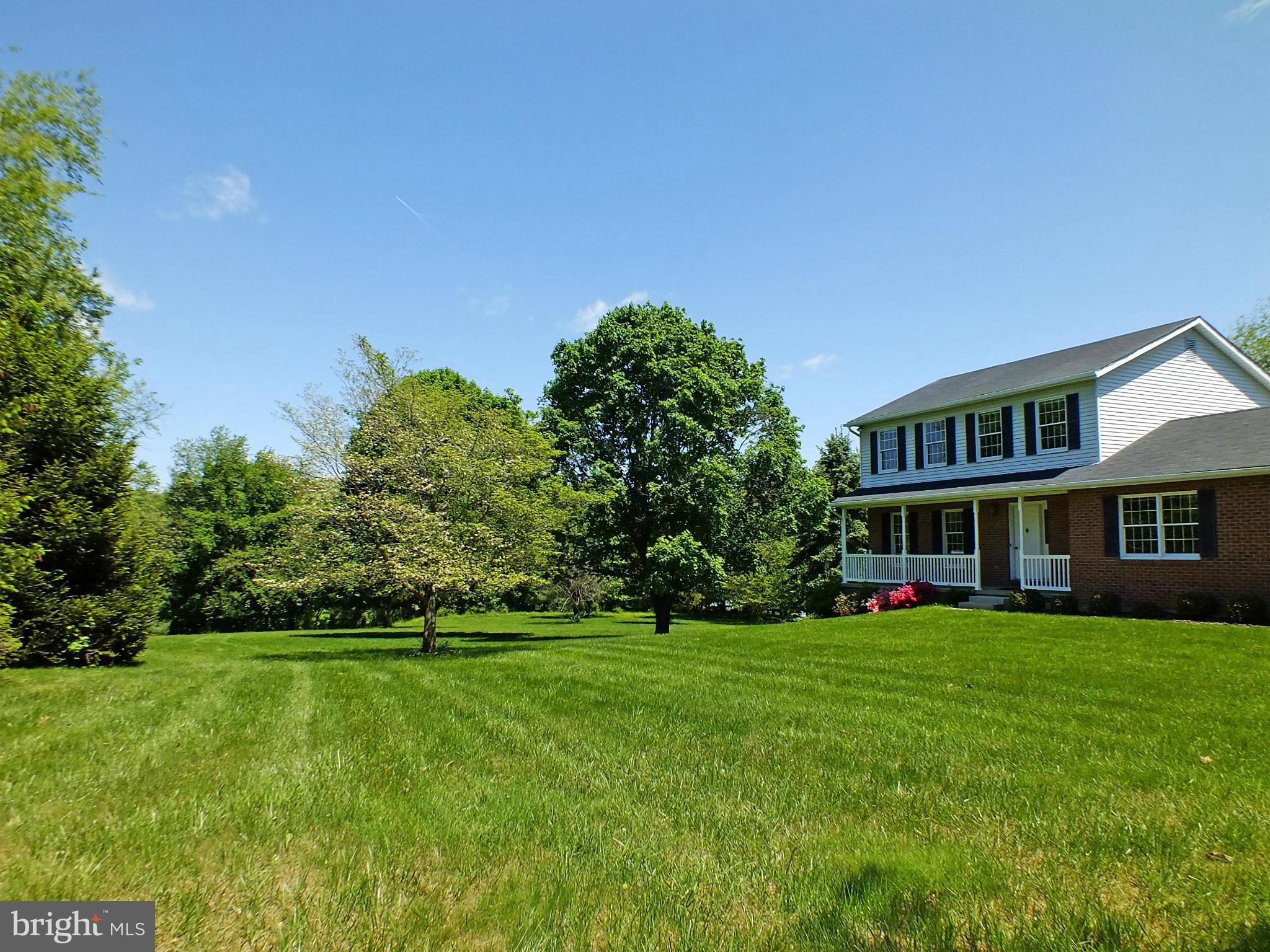 18249 Falls Road Hampstead, MD 21074 - Photo 2 of 30 a view of a house with a big yard