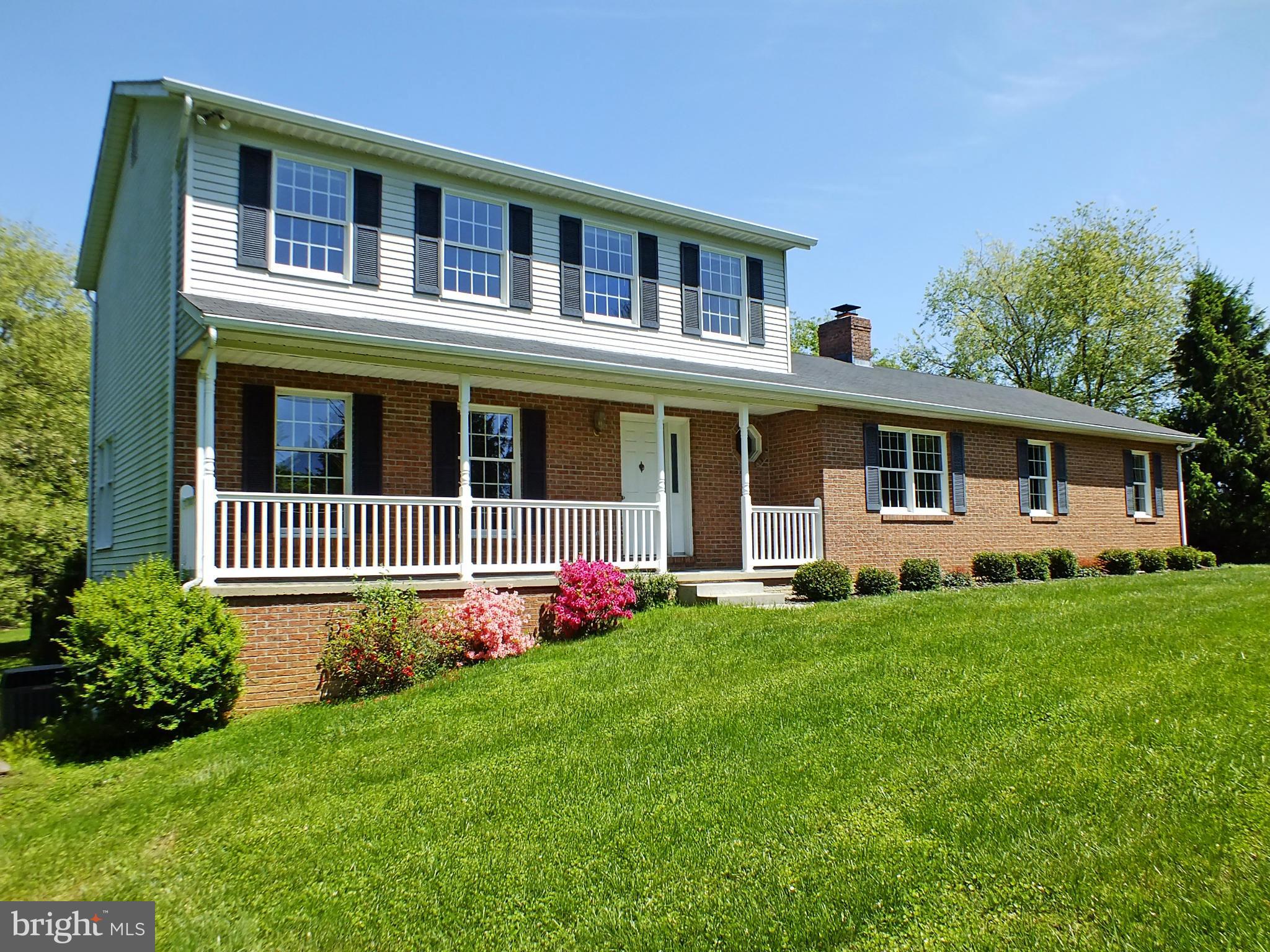 18249 Falls Road Hampstead, MD 21074 - Photo 24 of 30 a front view of a house with a garden