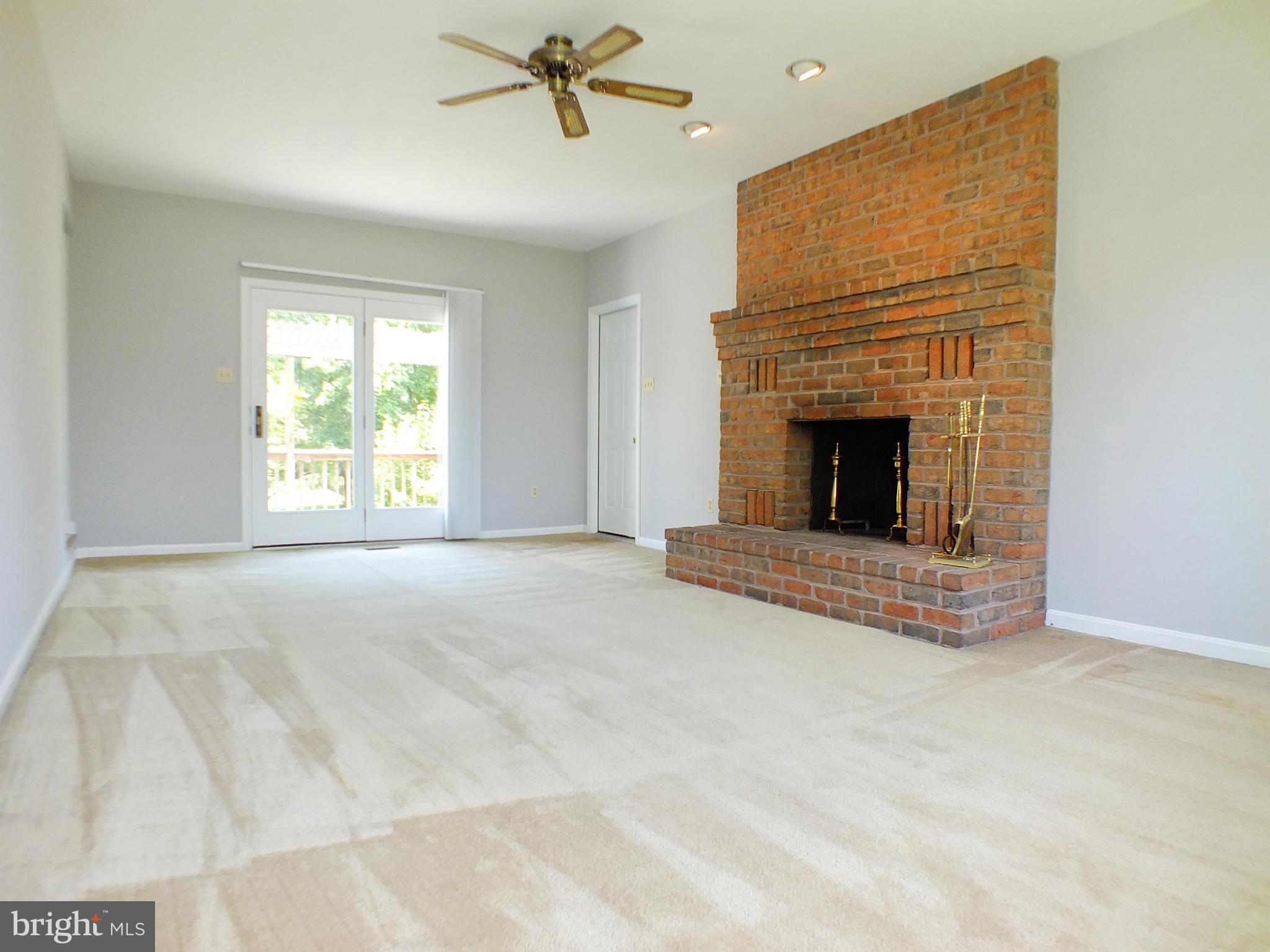 18249 Falls Road Hampstead, MD 21074 - Photo 10 of 30 a view of empty room with a fireplace