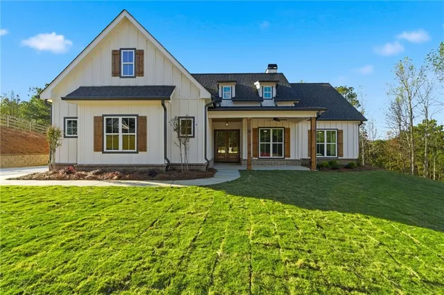 a front view of a house with a yard