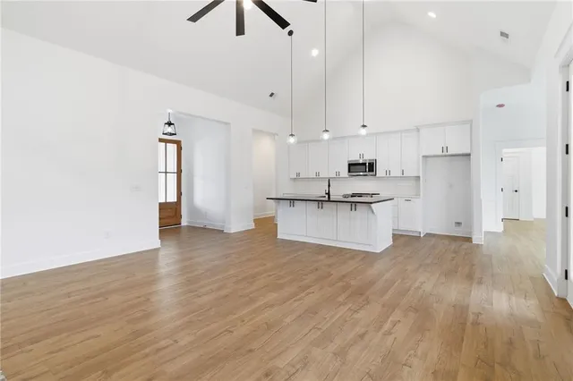 a view of kitchen with wooden floor