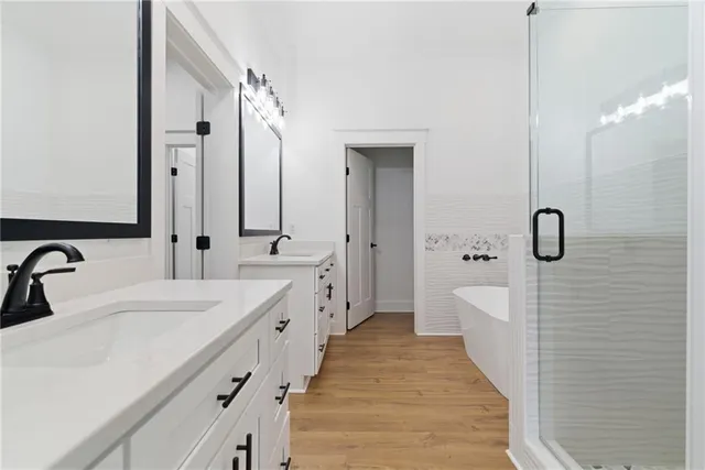 a bathroom with a bathtub and shower