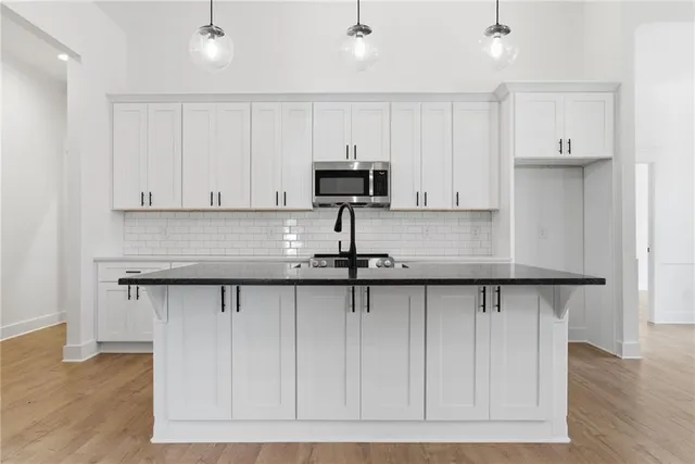 a kitchen with a sink and cabinets