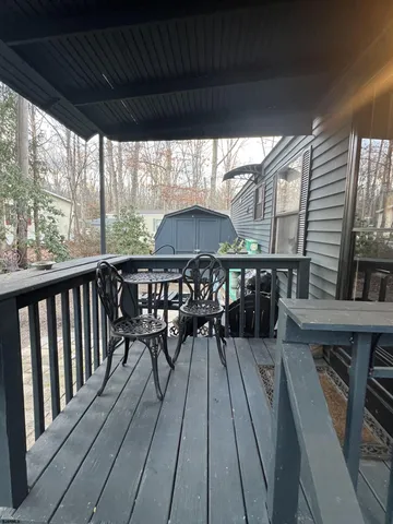 a view of a balcony with furniture