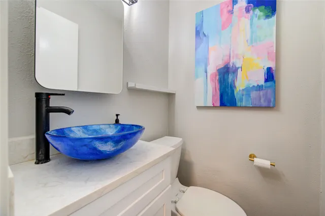 a bathroom with a toilet and a sink