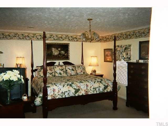 1178 Cash Road Creedmoor, NC 27522 - Photo 11 of 12 Large master Bedroom offers walk in closets, and huge whirlpool tub and separate shower!