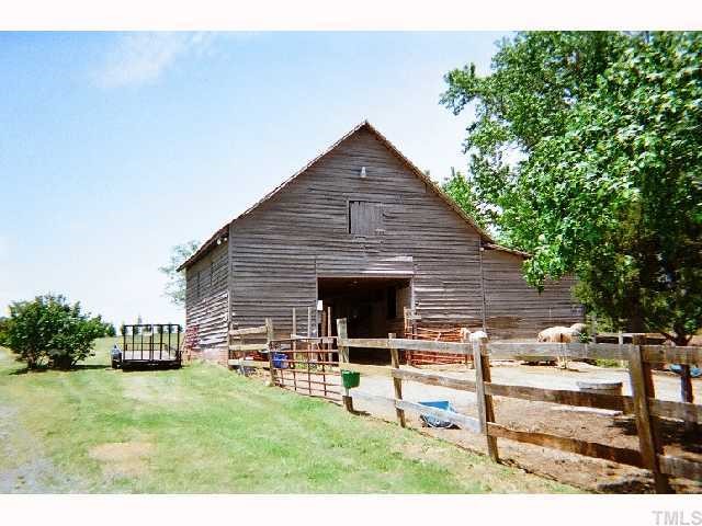 1178 Cash Road Creedmoor, NC 27522 - Photo 3 of 12 Barn, fenced paddock and pastures. As well as large storage out building