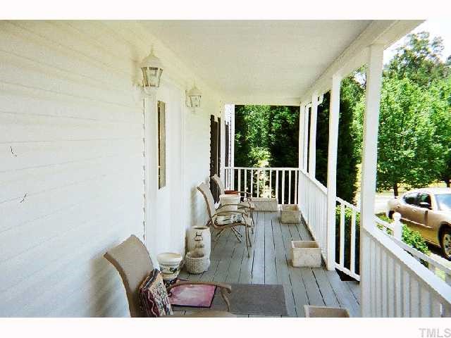 1178 Cash Road Creedmoor, NC 27522 - Photo 4 of 12 Rocking chair front porch, just perfect for catching those summer breezes.