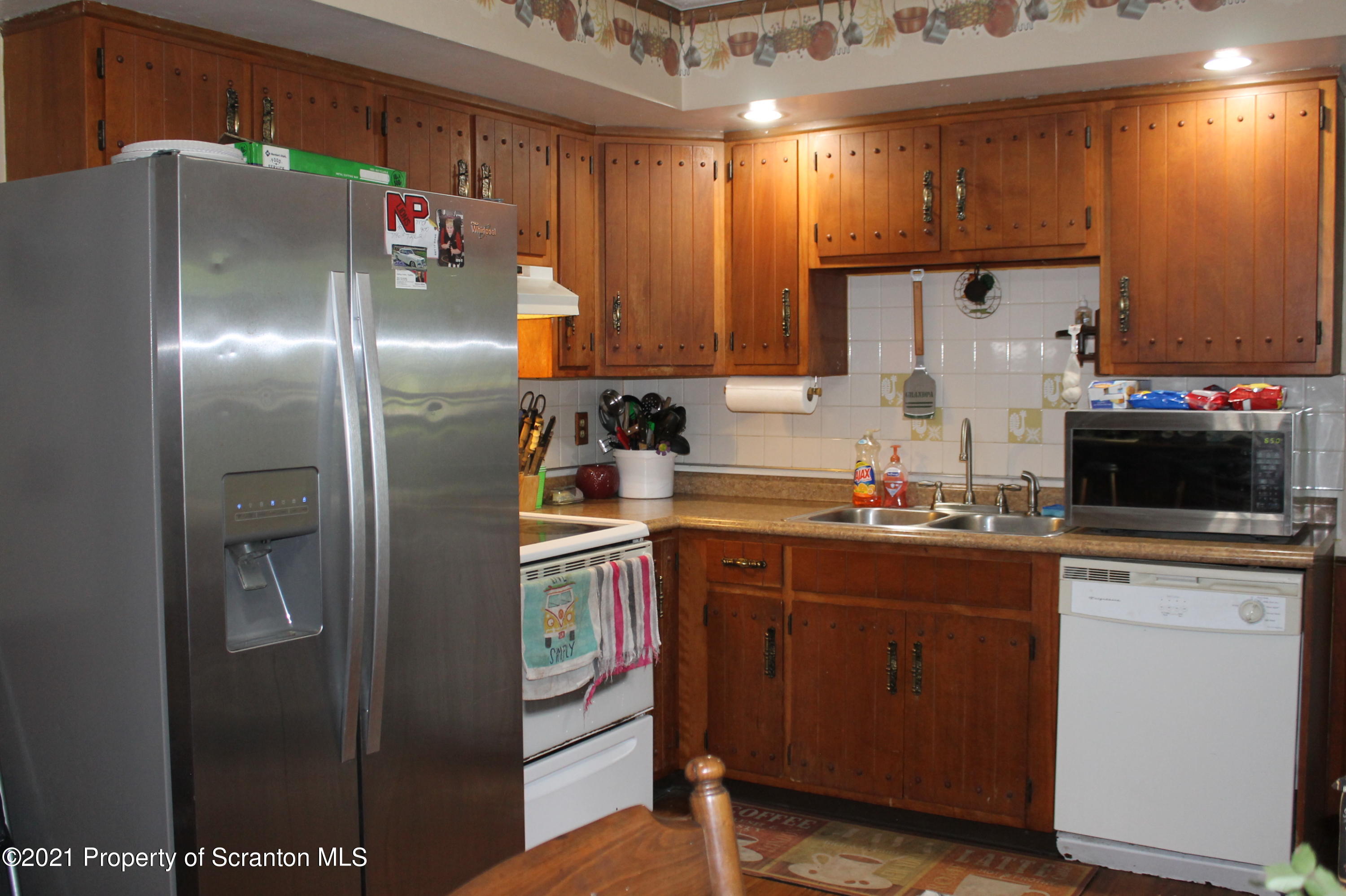 3431 Aberdeen Road Moscow, PA 18444 - Photo 3 of 28 a kitchen with stainless steel appliances granite countertop a refrigerator and a sink