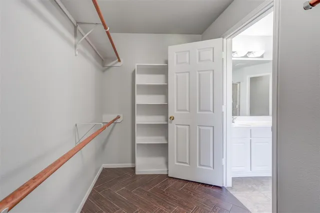 a view of an empty walk in closet