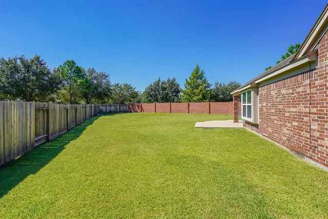 a view of pool with a backyard