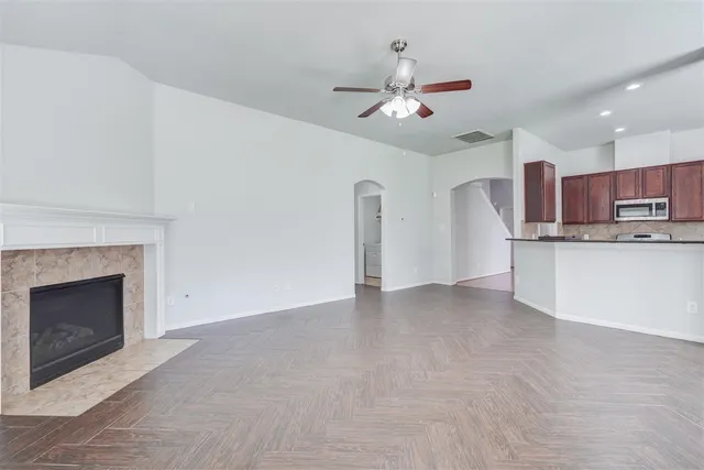 a view of a kitchen with a sink cabinets and a fireplace