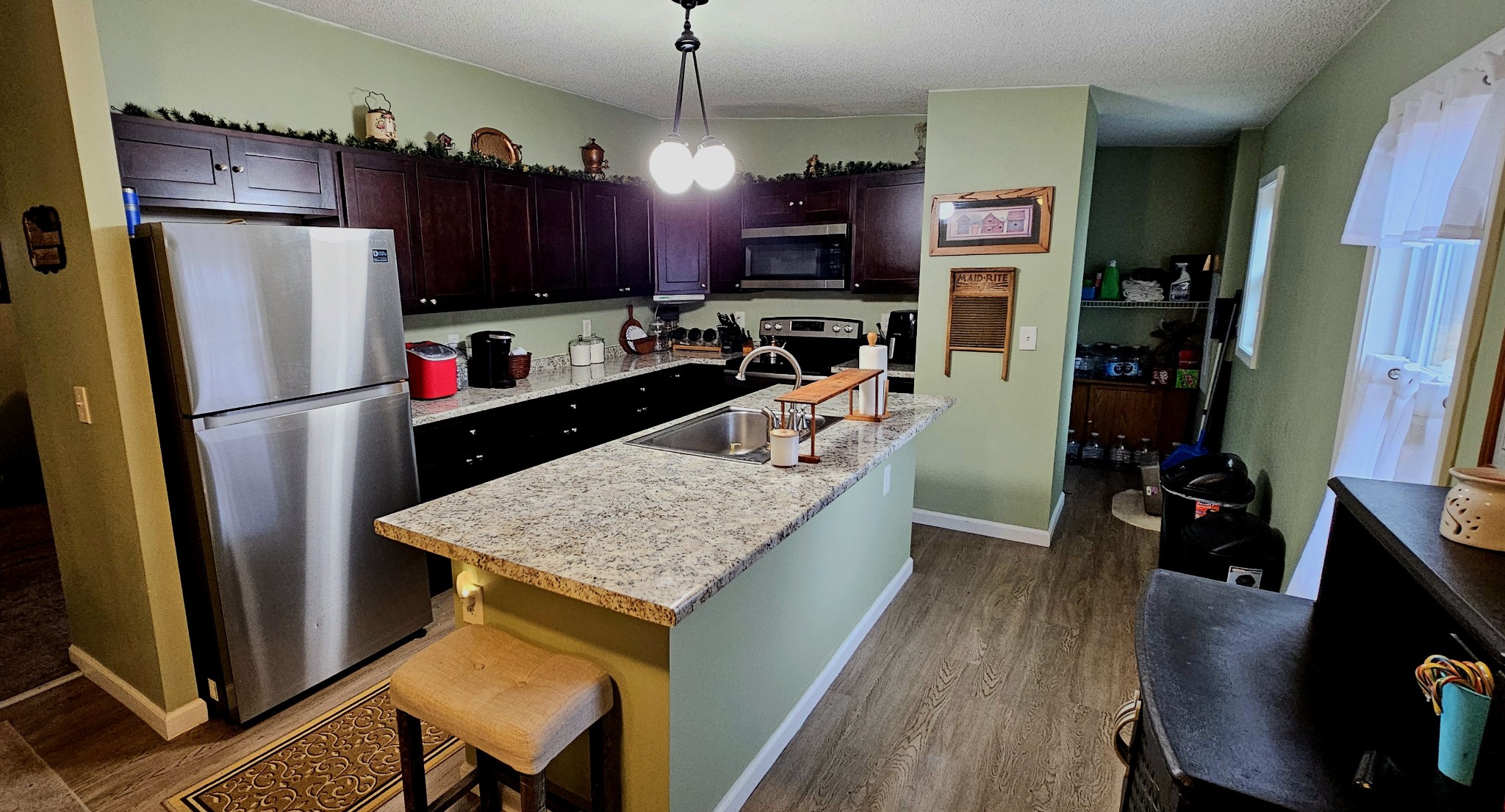8006 Ridgewood Road Goodlettsville, TN 37072 - Photo 11 of 19 a kitchen with stainless steel appliances granite countertop a refrigerator stove top oven a sink and dishwasher
