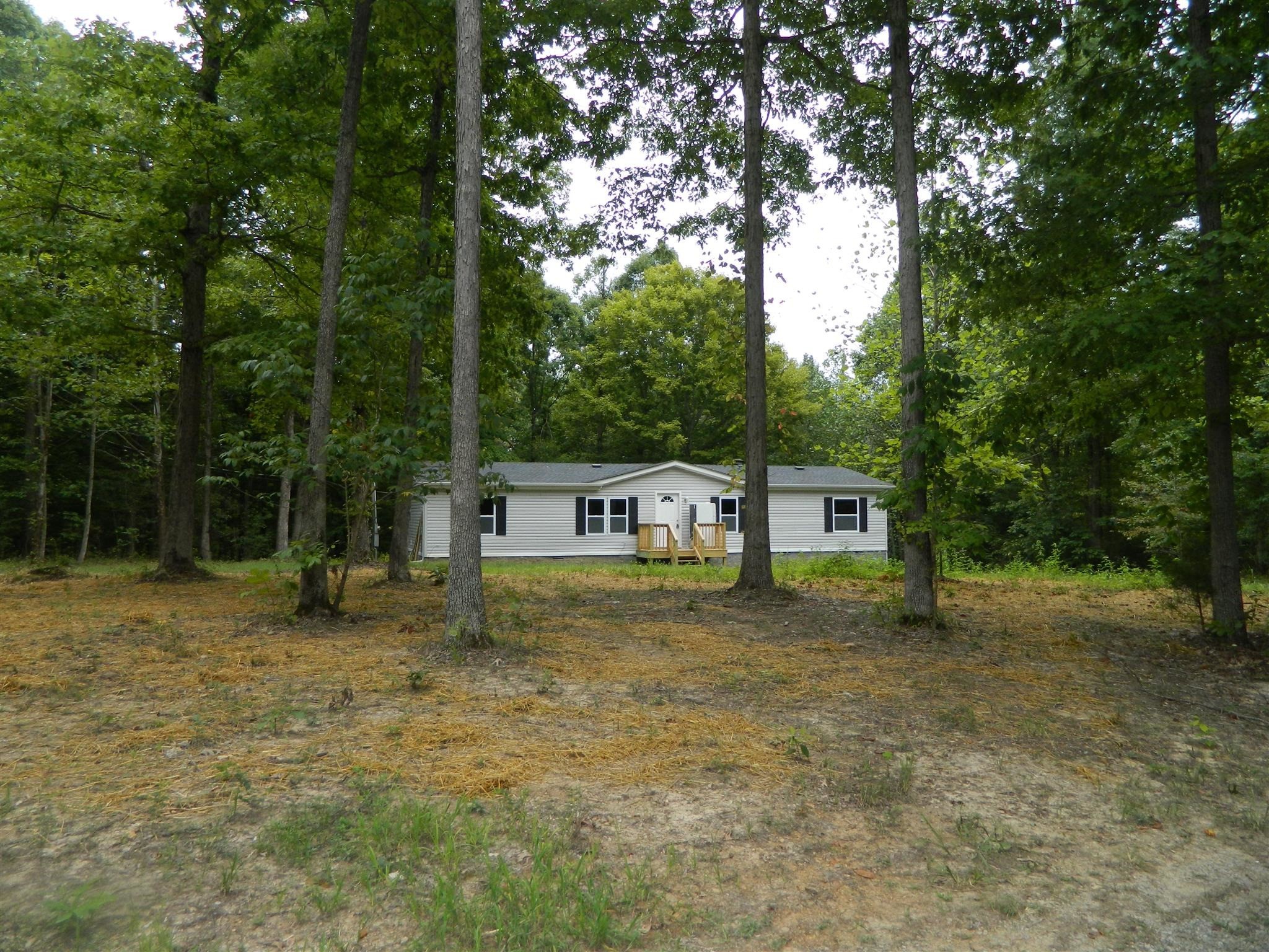 8006 Ridgewood Road Goodlettsville, TN 37072 - Photo 3 of 19 a house that has a tree in front of it