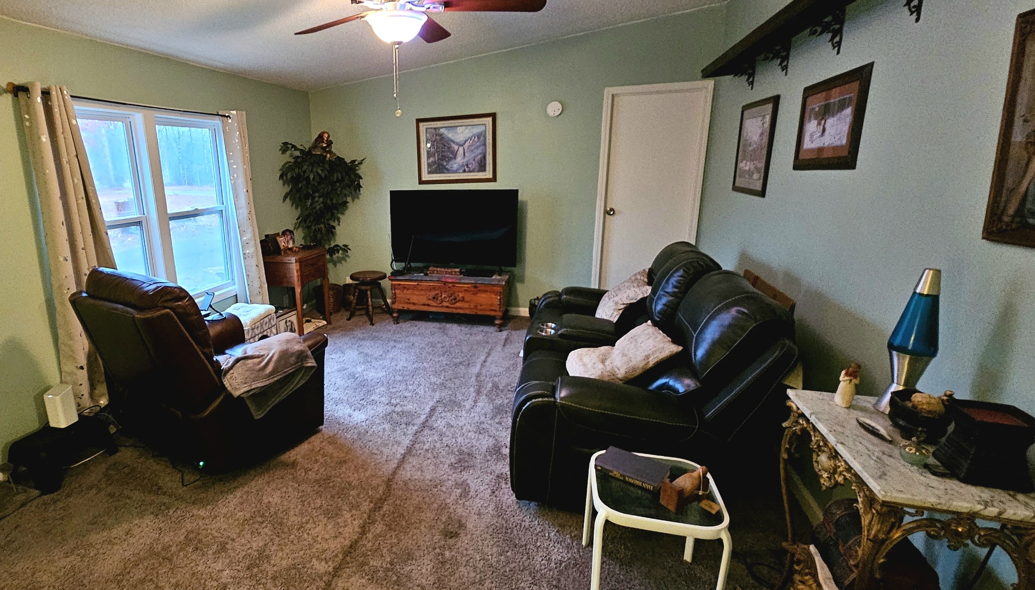 8006 Ridgewood Road Goodlettsville, TN 37072 - Photo 9 of 19 a living room with furniture and a flat screen tv