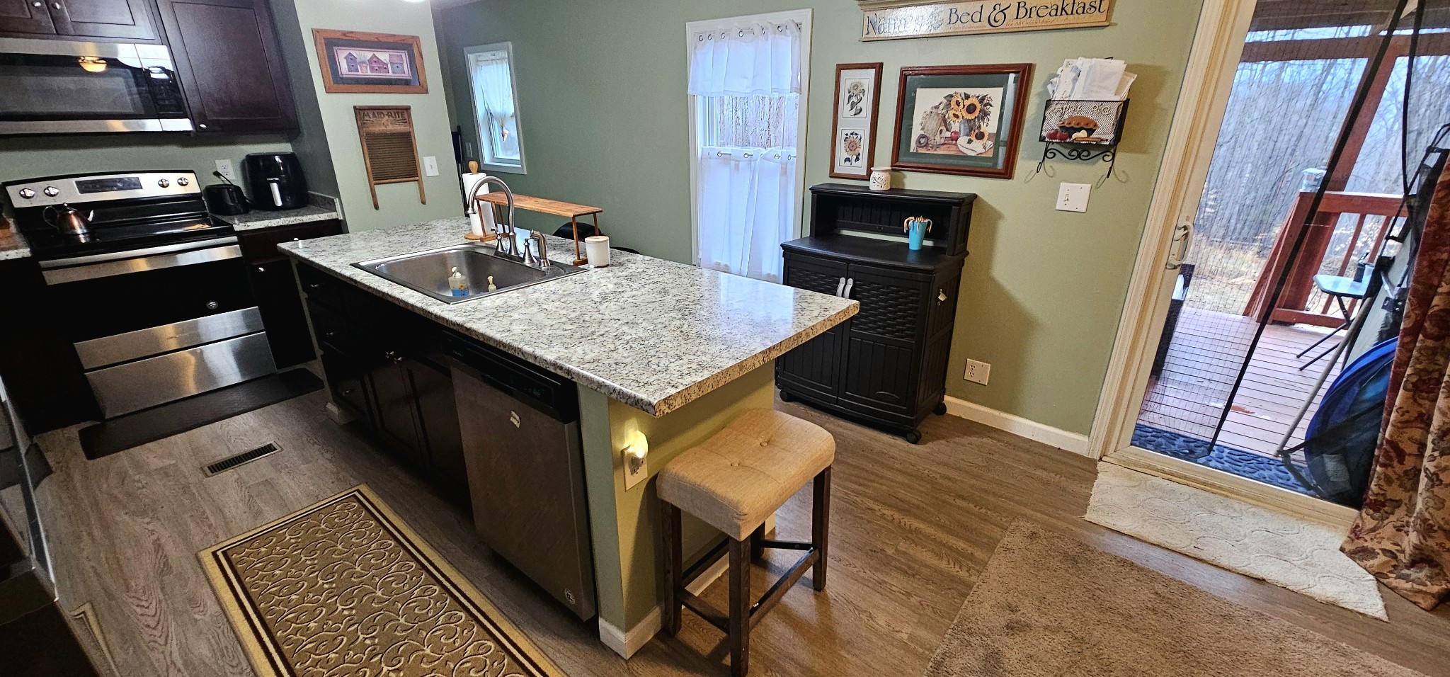 8006 Ridgewood Road Goodlettsville, TN 37072 - Photo 10 of 19 a kitchen with stainless steel appliances granite countertop a sink stove and refrigerator