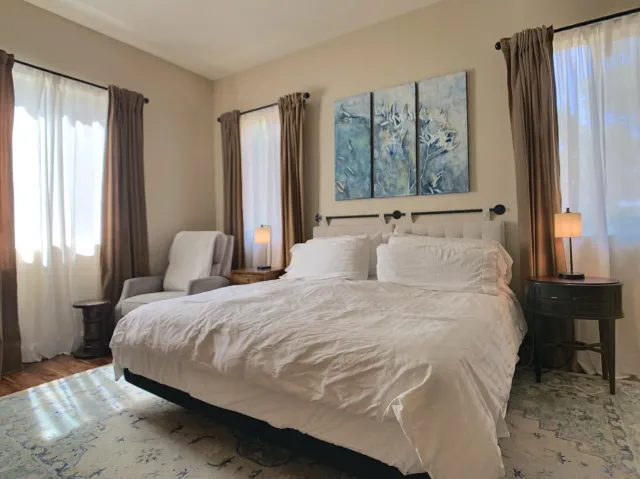 a view of patio with a table and chairs under an umbrella