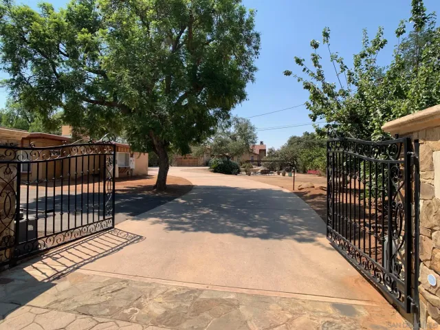 a view of street with wooden fence