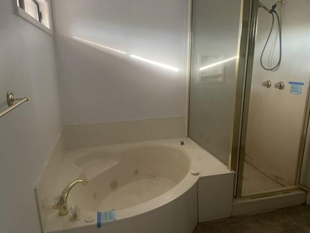 6047 Eden Square Crestview, FL 32539 - Photo 20 of 39 a bathroom with a bathtub