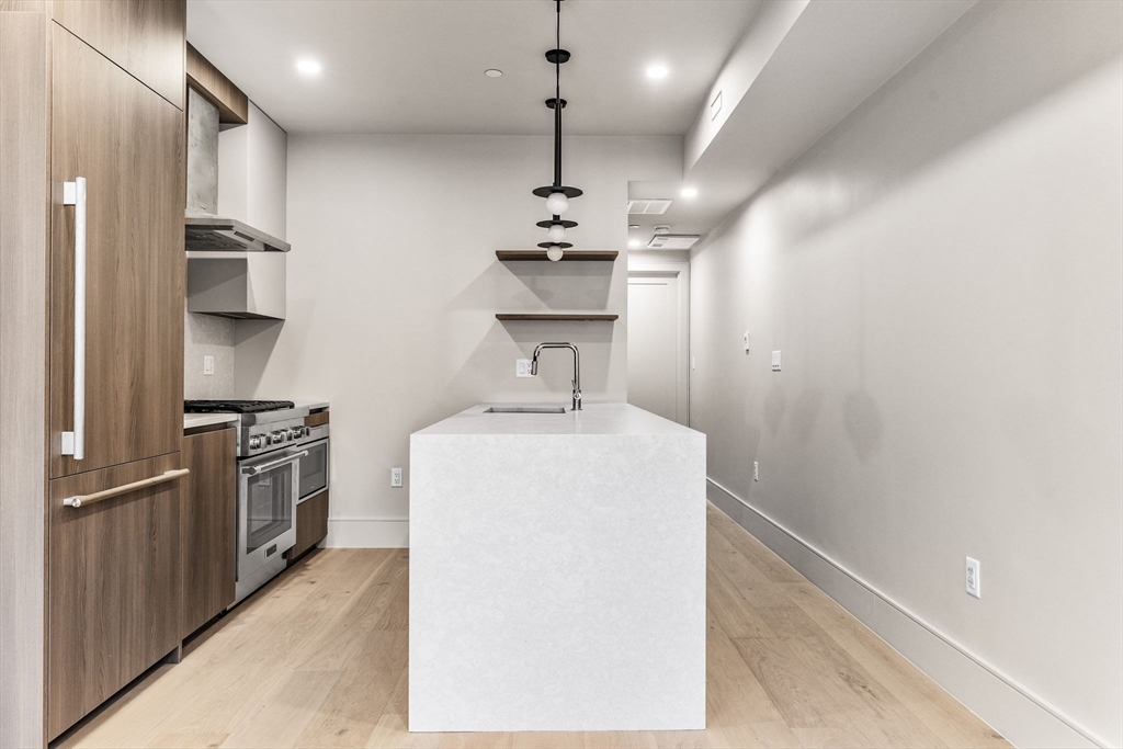 300 Franklin Street, Unit 2 Cambridge, MA 02139 - Photo 8 of 17 a kitchen with stainless steel appliances a refrigerator and a sink