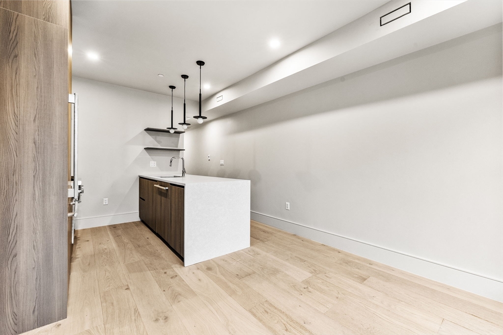 300 Franklin Street, Unit 2 Cambridge, MA 02139 - Photo 9 of 17 a view of a kitchen with a sink and dishwasher
