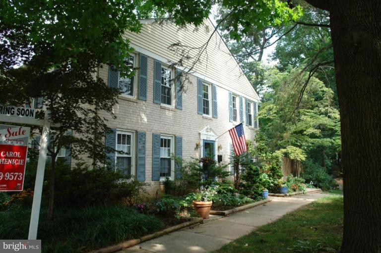 2440 Alsop Court Reston, VA 20191 - Photo 2 of 21 a view of a white house with a yard and potted plants