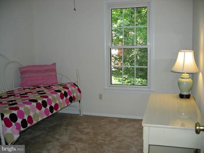 2440 Alsop Court Reston, VA 20191 - Photo 13 of 21 a bedroom with a bed and a window