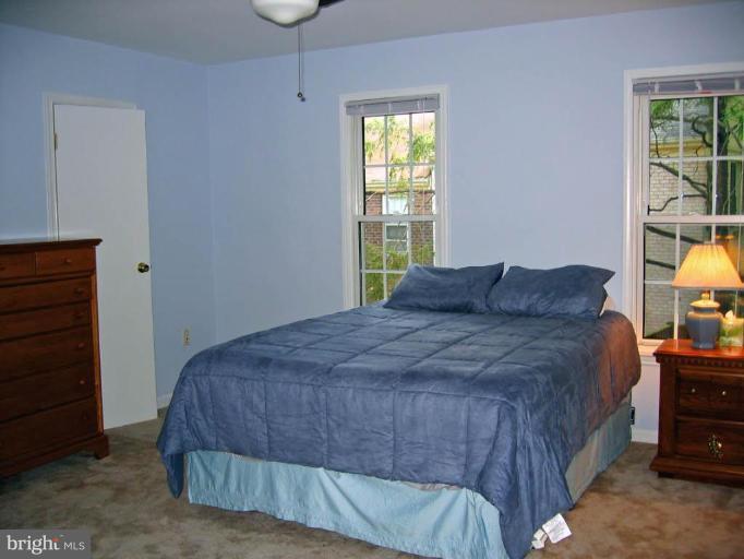 2440 Alsop Court Reston, VA 20191 - Photo 16 of 21 a bedroom with a bed and a window