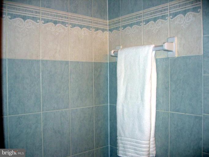 2440 Alsop Court Reston, VA 20191 - Photo 17 of 21 a bathroom with a shower and a glass door shower