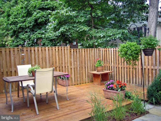 2440 Alsop Court Reston, VA 20191 - Photo 18 of 21 a view of a chairs and table in the back yard of the house