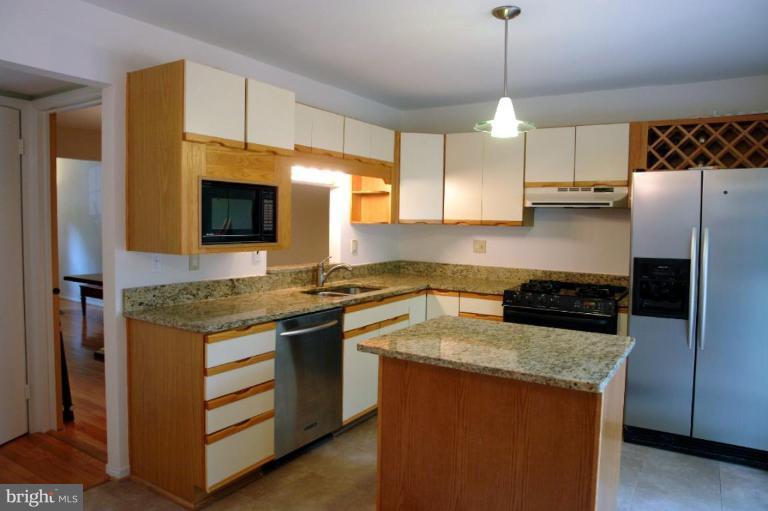 2440 Alsop Court Reston, VA 20191 - Photo 6 of 21 a kitchen with stainless steel appliances granite countertop a stove a sink and a refrigerator