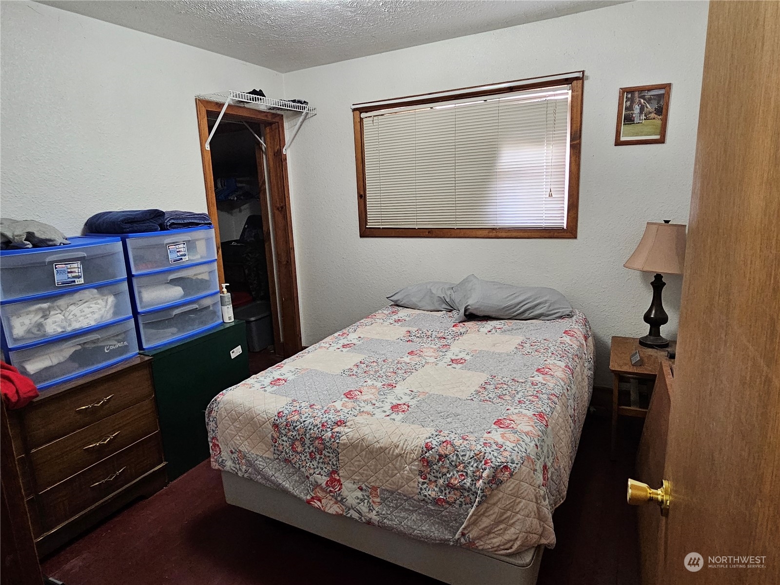 106 3rd Street Riverside, WA 98849 - Photo 20 of 38 a bedroom with a bed and a dresser