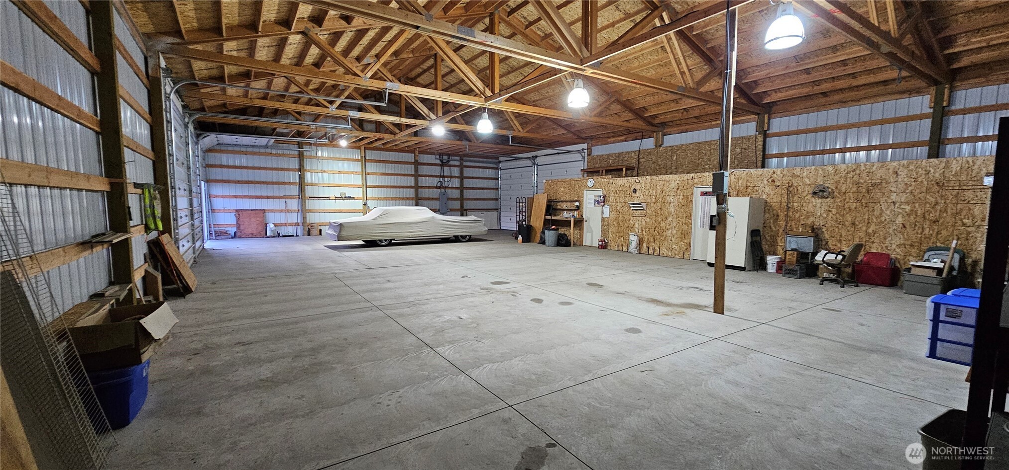 106 3rd Street Riverside, WA 98849 - Photo 5 of 38 a view of a garage with parked cars